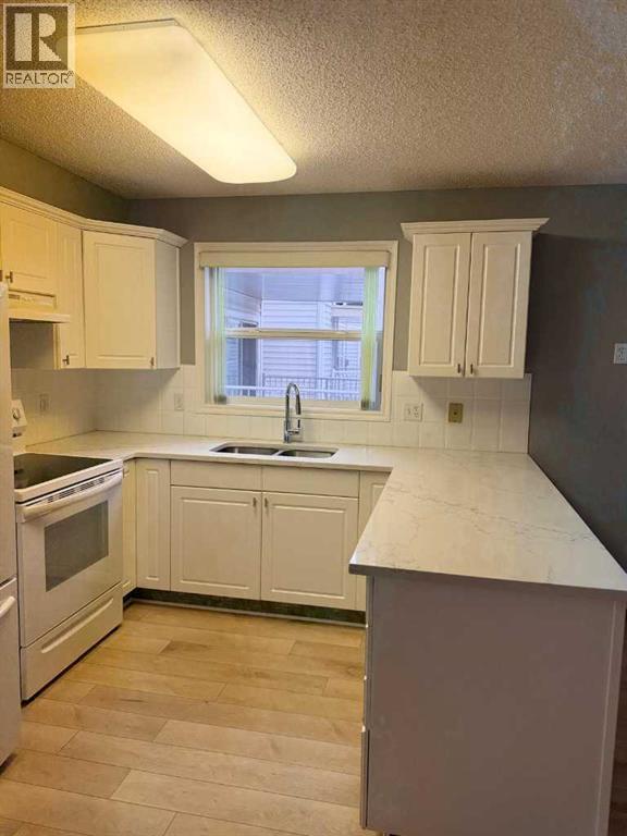 216, 6800 Hunterview Drive Nw, Calgary, Alberta  T2K 6K5 - Photo 9 - A2278413