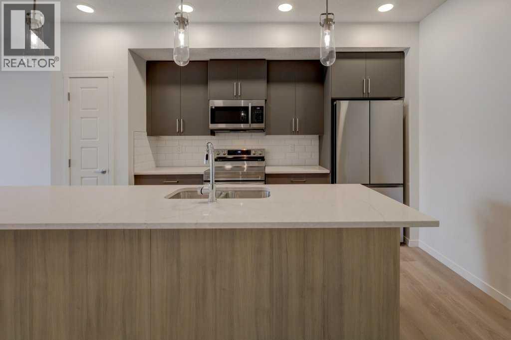 219, 245 Edith Place Nw, Calgary, Alberta  T3R 2C9 - Photo 5 - A2275303