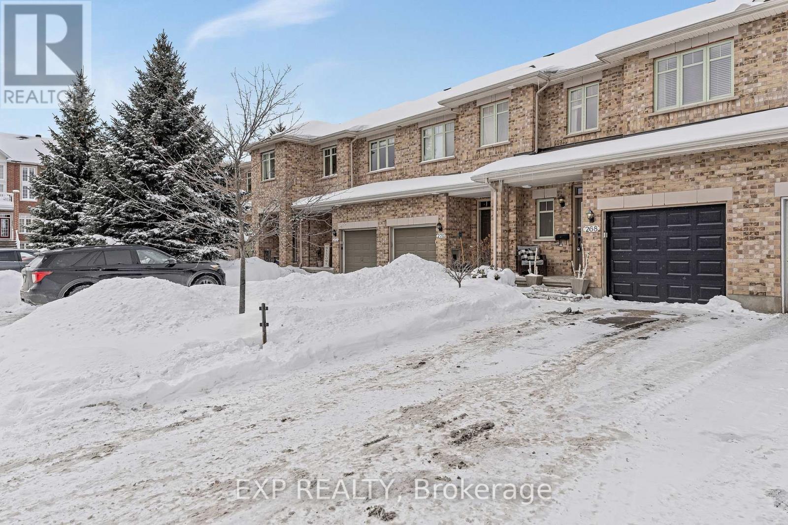 Beautifully updated freehold townhome in desirable Riverside South, offering 3 bedrooms and 2.5 bathrooms with a bright, open-concept layout. The main level features a spacious living and dining area highlighted by hardwood floors and a cozy fireplace. The large galley kitchen is well appointed with stainless steel appliances, a breakfast bar, and a sunny breakfast nook.The upper level showcases a generous primary suite complete with a beautifully updated 5-piece ensuite, walk-in closet, and access to a versatile loft area. Bedrooms two and three are both generous in size, featuring large windows and ample closet space. A full 4-piece bathroom completes this level.The fully finished lower level includes a gas fireplace and a stylish hanging/sliding door leading to a dedicated home gym. A spacious laundry room with shelving and countertop adds to the home's functionality. Enjoy a fully fenced backyard and single-car garage. Ideally located just steps from the LRT, public transit, schools, shopping, restaurants, and more. (id:48254)
