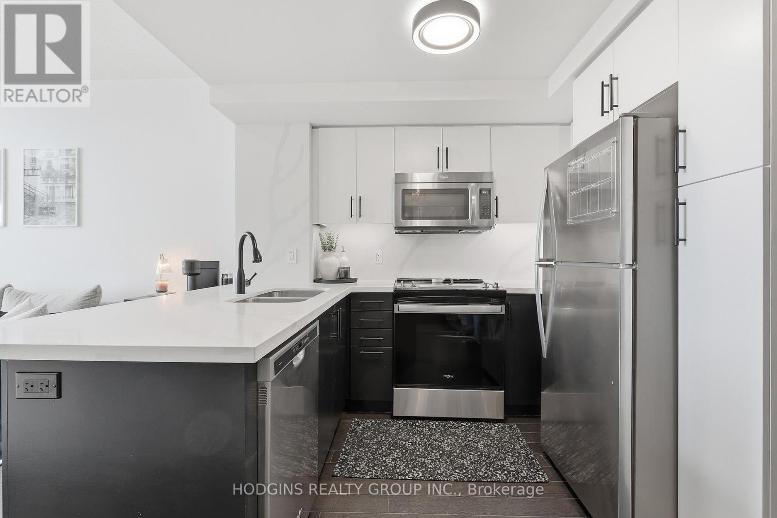 214 - 65 Speers Road, Oakville, Ontario  L6K 0J1 - Photo 4 - W12762998