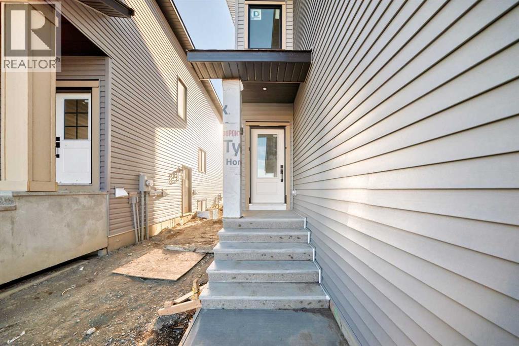 516 Heritage Boulevard, Cochrane, Alberta  T4C 2J8 - Photo 2 - A2277144