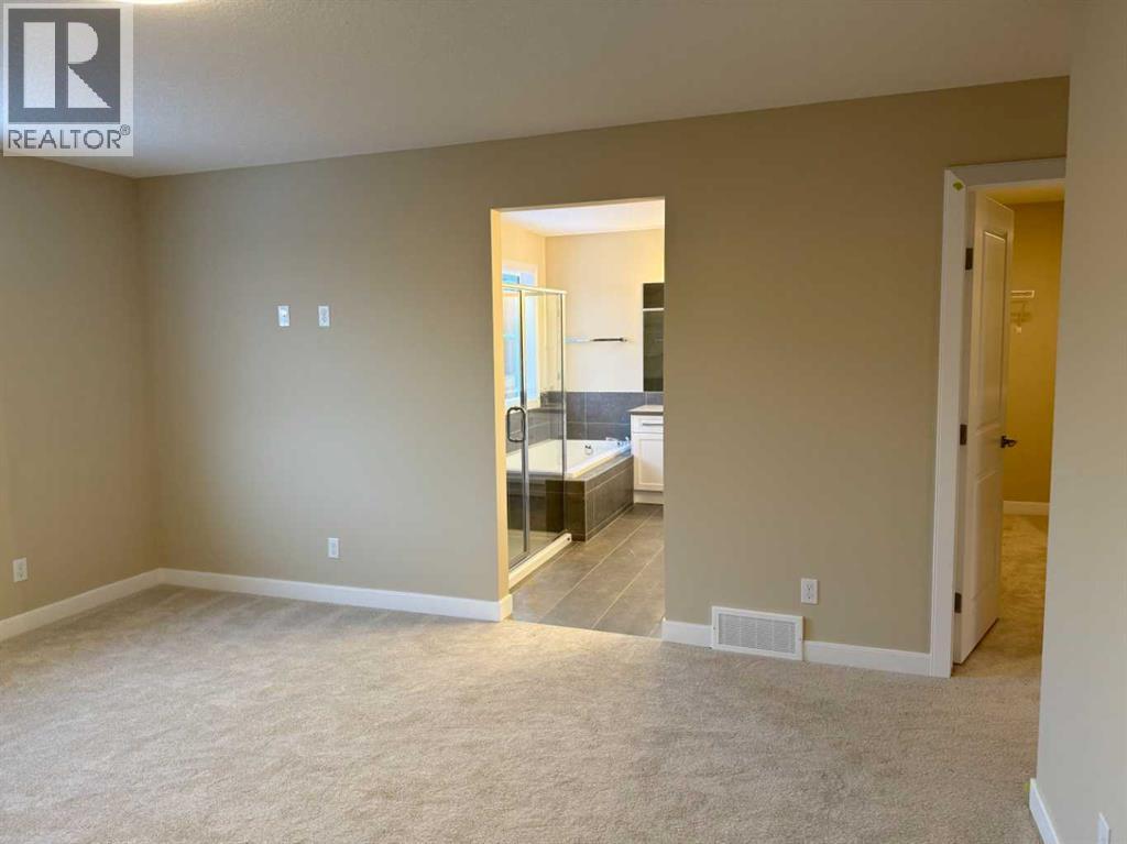 63 Sunrise Heath, Cochrane, Alberta  T4C 3C5 - Photo 33 - A2269947