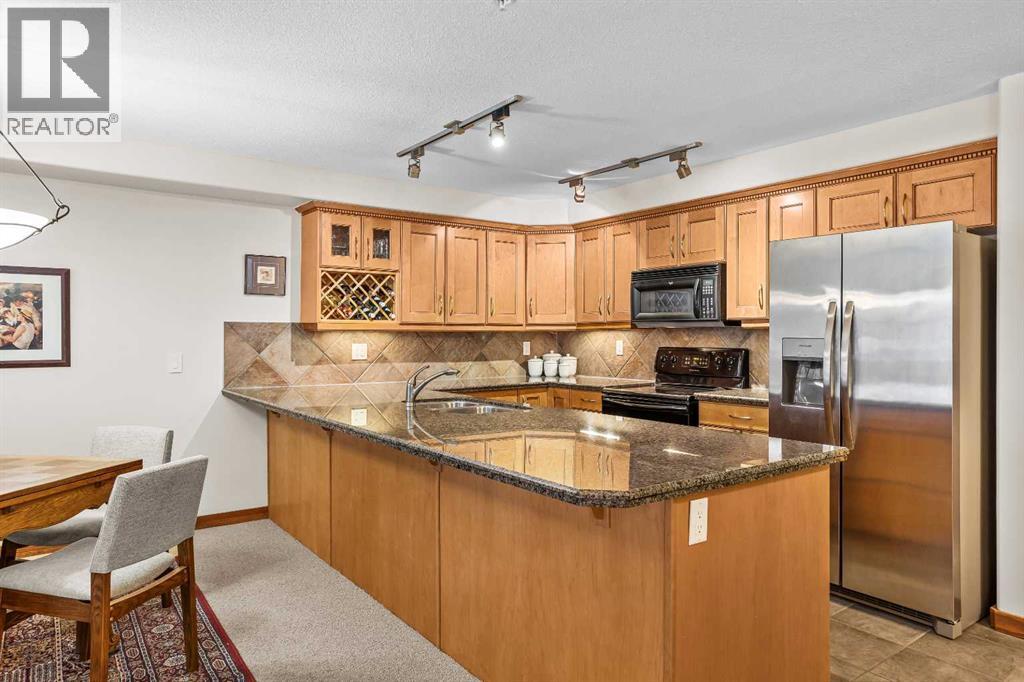 112, 150 Crosbow Place, Canmore, Alberta  T1W 3H5 - Photo 2 - A2272912