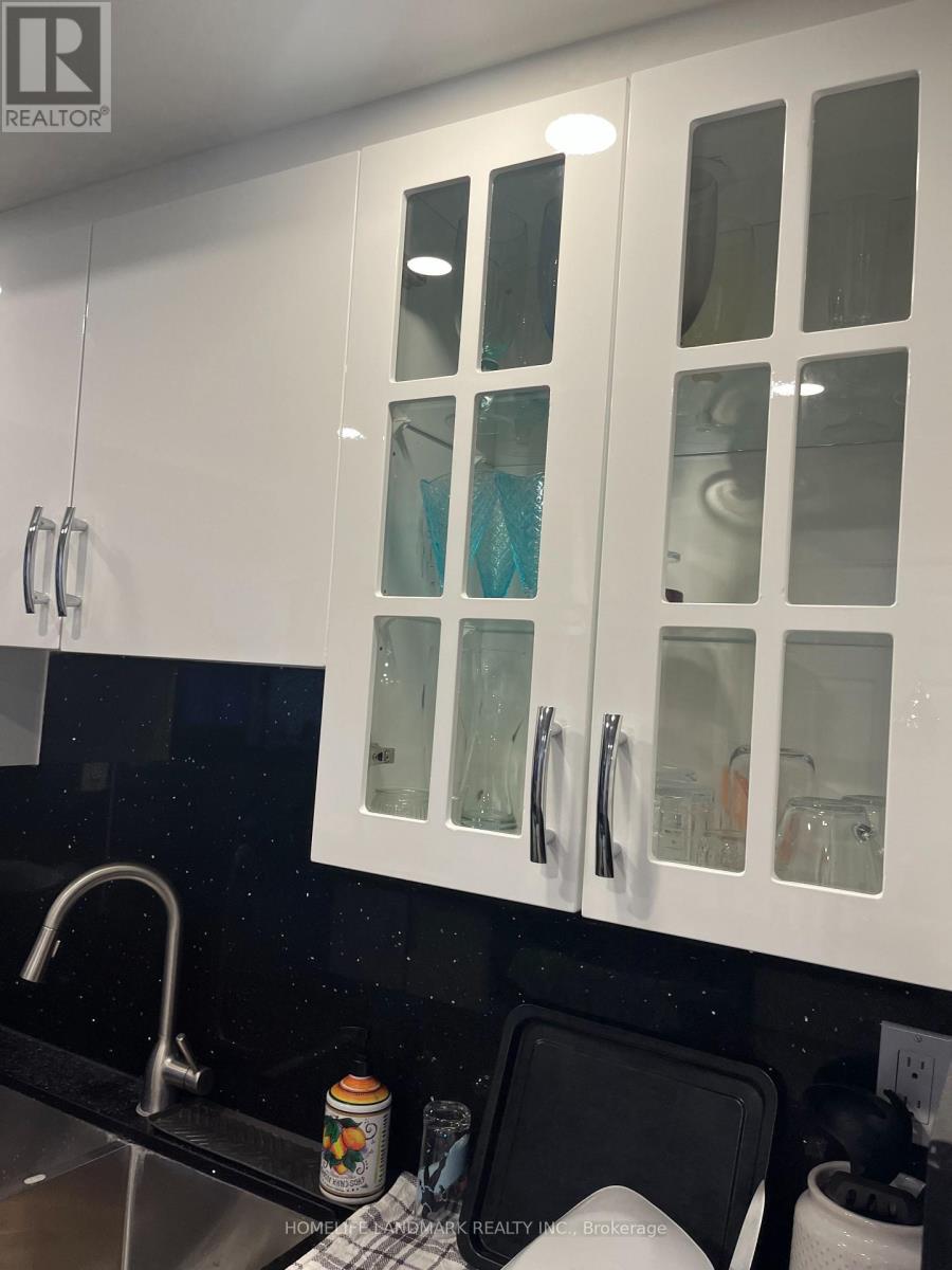 1409 - 812 Burnhamthorpe Road, Toronto, Ontario  M9C 4W1 - Photo 5 - W12646352