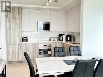 403 - 297 Oak Walk Drive, Oakville (Ro River Oaks), Ontario  L6H 3R6 - Photo 3 - W12769596