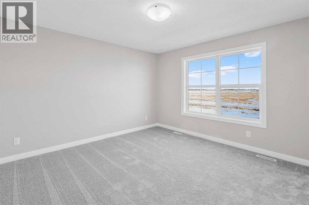 423 Hotchkiss Manor, Calgary, Alberta  T3S 0N3 - Photo 25 - A2283550