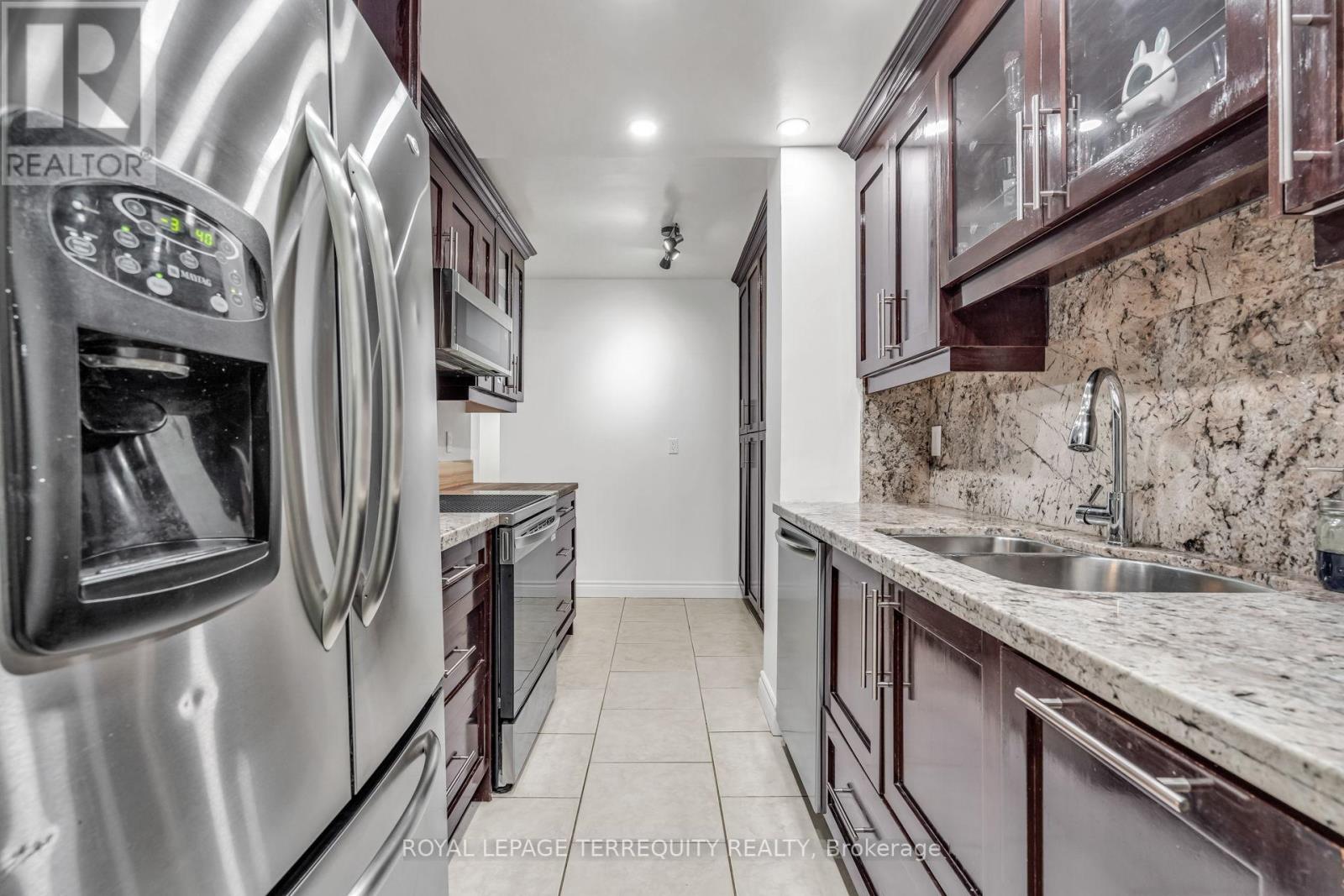 410 - 812 Burnhamthorpe Road, Toronto, Ontario  M9C 4W1 - Photo 11 - W12771472