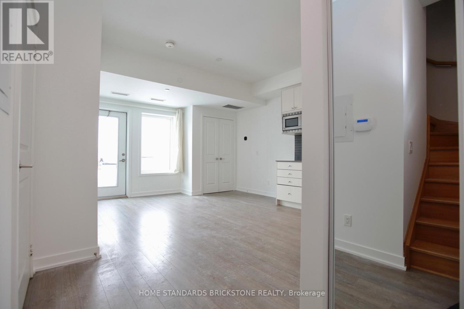 207 - 155 Downsview Park Boulevard, Toronto, Ontario  M3K 0E3 - Photo 5 - W12772376