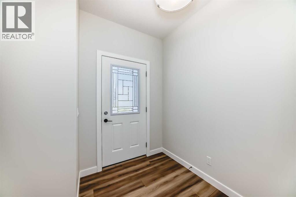 105 Creekside Way Sw, Calgary, Alberta  T2X 4A9 - Photo 5 - A2276832