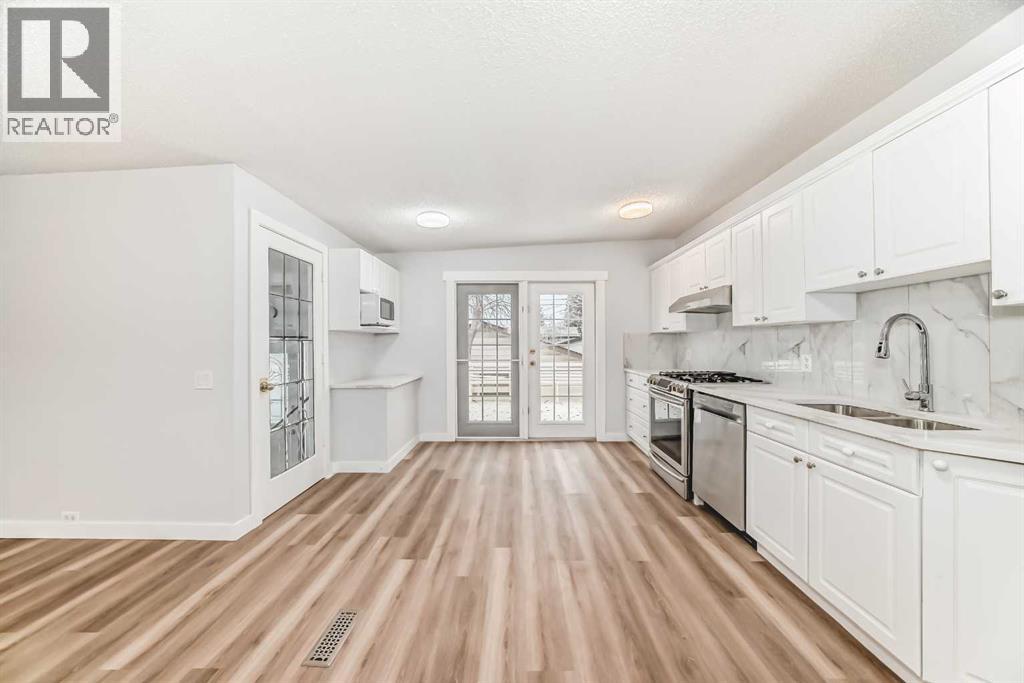 307 Huntridge Road Ne, Calgary, Alberta  T2K 4B8 - Photo 6 - A2272014