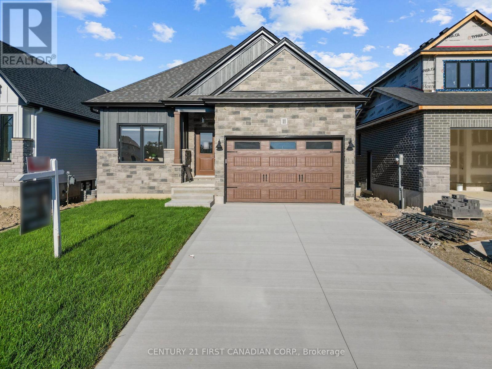 <div class="slider-price">$704,900</div><p>11 Sheldabren Street, North Middlesex, Ontario</p>