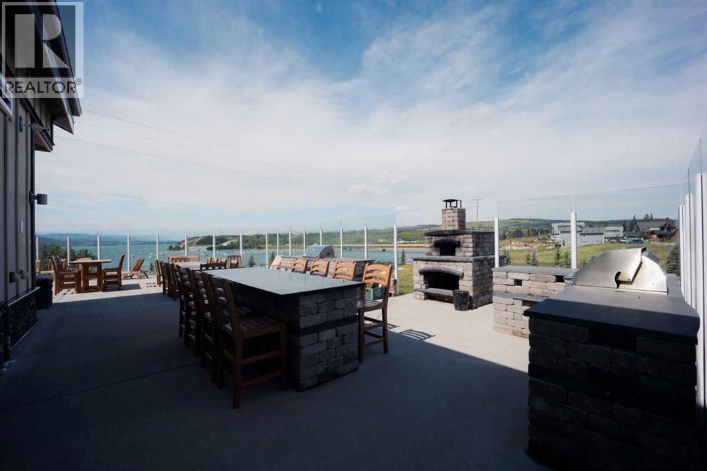 236 Cottage Club Crescent, Rural Rocky View County, Alberta  T4C 1B1 - Photo 5 - A2245247