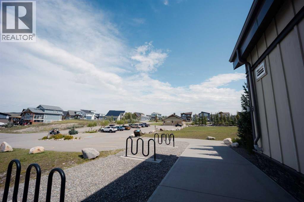 236 Cottage Club Crescent, Rural Rocky View County, Alberta  T4C 1B1 - Photo 4 - A2245247