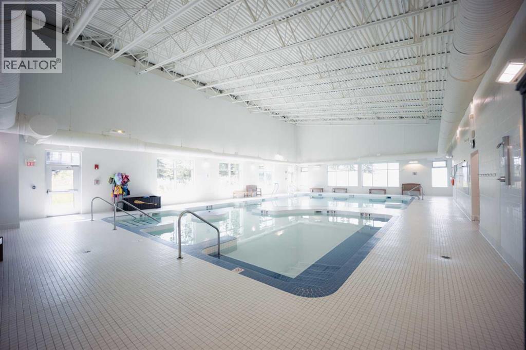 236 Cottage Club Crescent, Rural Rocky View County, Alberta  T4C 1B1 - Photo 12 - A2245247