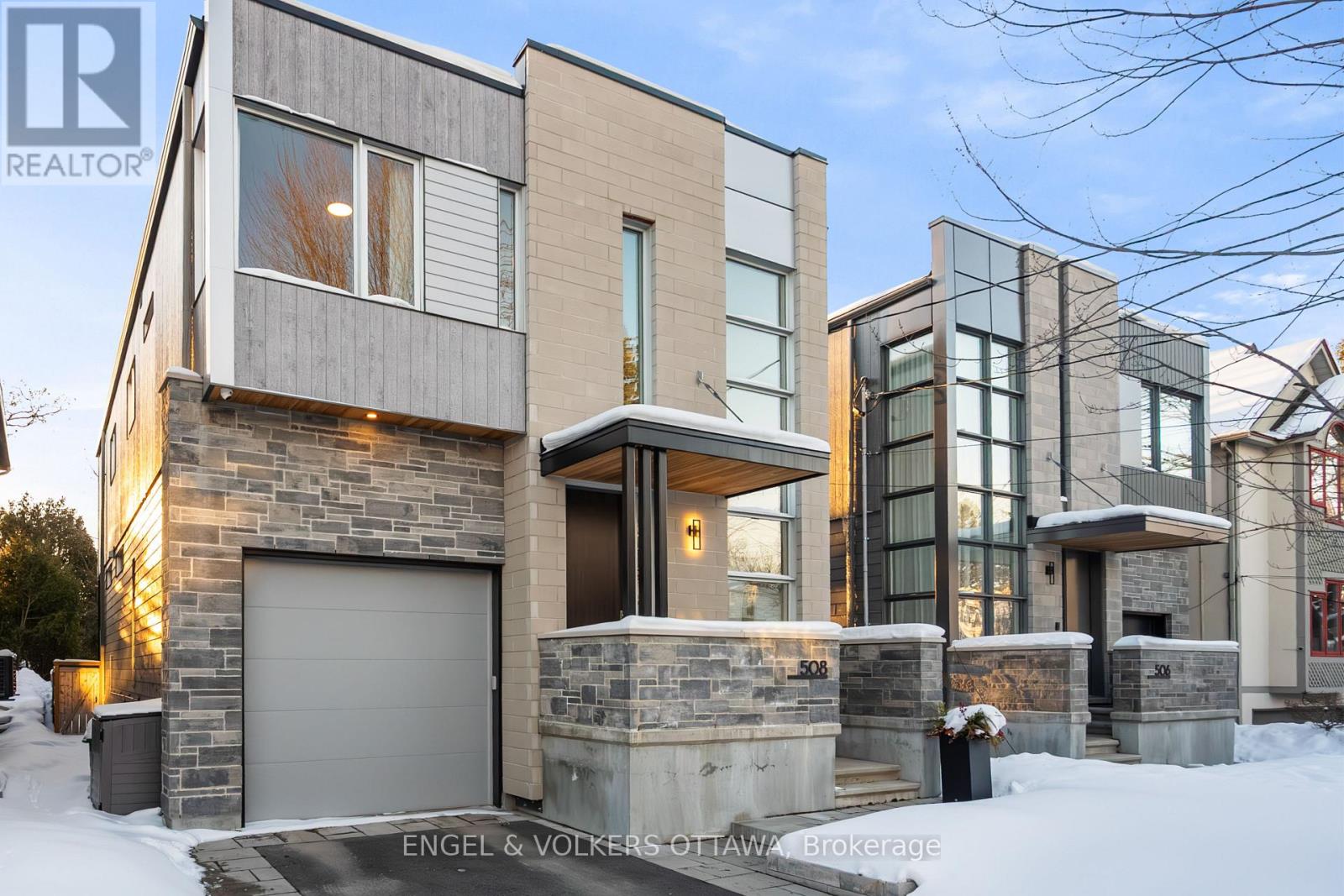 508 Roosevelt Avenue is a distinguished custom residence by Cartesian Homes, offering refined modern living in the heart of Westboro, one of Ottawa's most desirable and established neighbourhoods. Spanning 3,045 square feet, this 4+1 bedroom, 5-bathroom home is defined by architectural precision, elevated craftsmanship, and exceptional livability. With 10-foot ceilings on both the main and second floors, the home is filled with volume and light, enhanced by its west-facing orientation and beautiful natural sunlight throughout the day.The heart of the home is a custom Cedar Ridge kitchen, featuring bespoke cabinetry, exceptional millwork, and luxury appliances-designed for both everyday living and sophisticated entertaining. The dining area is anchored by a beautiful built-in hutch, adding architectural character and practical elegance. Living spaces are unified by a striking stone-clad fireplace on the main level, echoed by a second stone fireplace in the fully finished lower level. With heated floors, the lower level offers a warm and inviting extension of the home. The upper level features two private ensuites, including a spa-inspired primary ensuite defined by thoughtful design and refined finishes. All five bathrooms are custom designed, including a bespoke powder room, reinforcing the home's attention to detail. Function meets luxury with a custom mudroom, while year-round comfort is ensured by a heated driveway. Set on an extra-deep 115-foot lot, the west-facing backyard features a beautiful back porch and patio area-perfect for entertaining and enjoying evening sun.Ideally located moments from Westboro Village, acclaimed restaurants, boutique shopping, cafés, fitness studios, and the Ottawa River pathways, this home represents a rare opportunity to own a design-forward, newly built residence in a mature, lifestyle-rich neighbourhood. (id:48254)