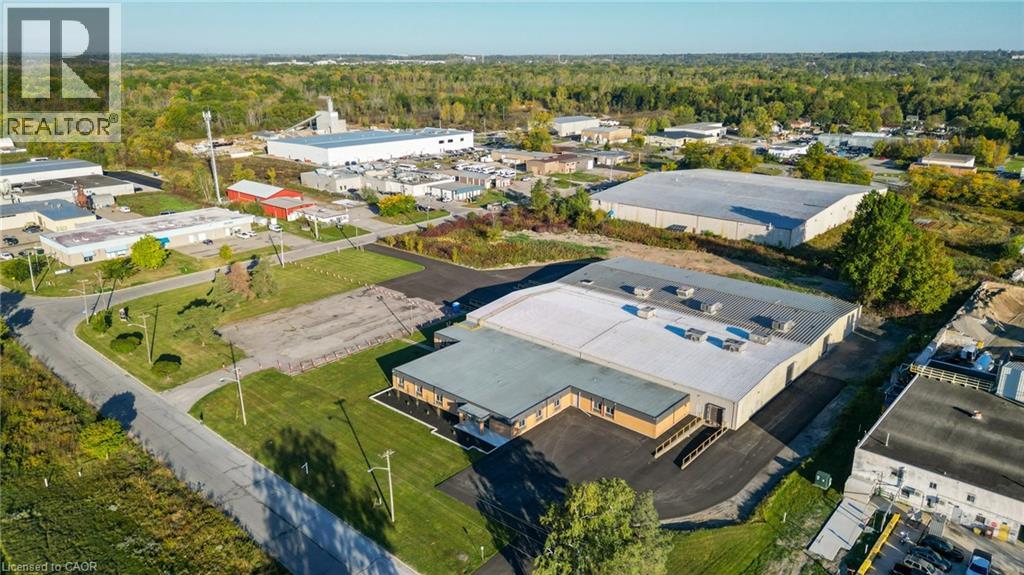 Prime Industrial Opportunity in Niagara Falls’ Stanley Avenue Business Park. Presenting a fully upgraded and vacant industrial property with approximately 52,705 sq. ft. of space above grade, and an additional 2,675 sq. ft. in the basement boasting 55,380 sq. ft. in the heart of the Stanley Avenue Business Park. Properties of this size and condition, available for immediate occupancy, are a true rarity in this market. The facility features 7 bay doors of which 4 drive-in doors and 3 truck-level loading docks for seamless logistics. Recent enhancements include a fully fire-certified and monitored building with all-new sprinkler heads, new radiant tube heating, 8 rooftop HVAC units for heating and cooling, completely new Interior/Exterior LED lighting and 1,200 amp 600 volt service! The property also has a brand-new torch-down roof over the flex space, along with fresh asphalt. This business park has benefited from major infrastructure investments by the City of Niagara, this turnkey space is truly a standout opportunity. Come see how this rare vacant gem can elevate your operations! (id:48254)