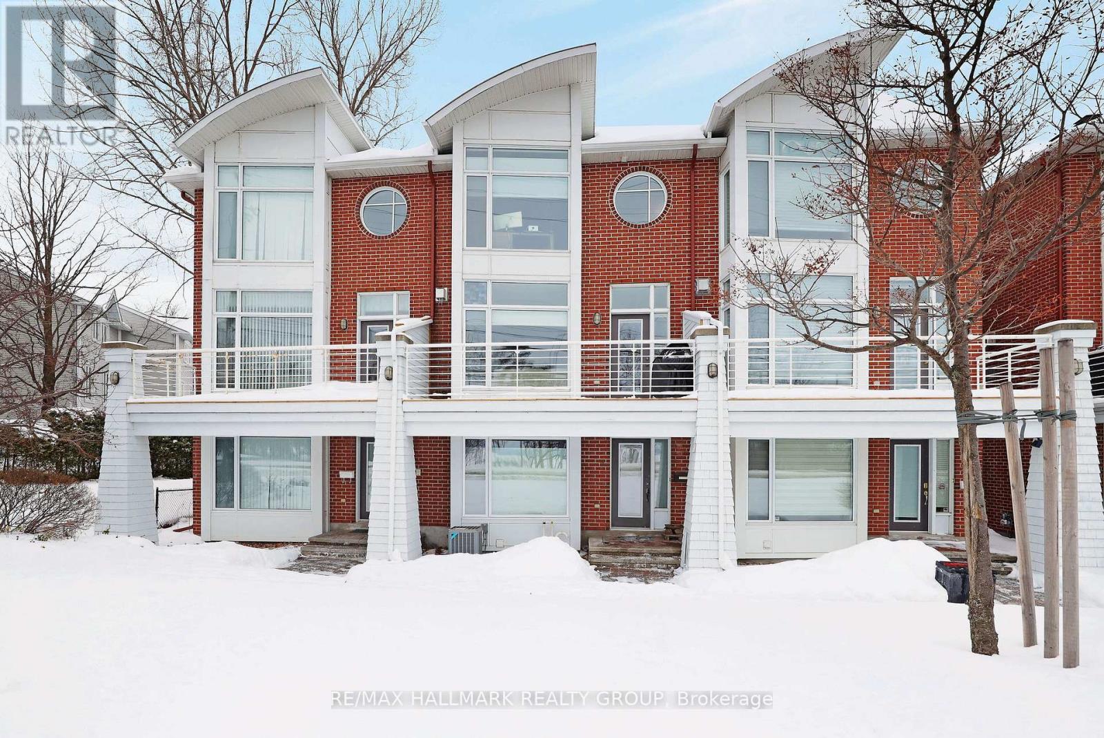5 Nautica Private is a spacious and well-lit property situated opposite the Nepean Sailing Club, Andrew Haydon Park, and the Ottawa River. Hobin designed, the layout is versatile providing two large bedrooms and a ground level flex space that can be used as an office, recreation room or third bedroom. The spacious kitchen and eating are features a granite island, stainless steel appliances and pantry, plumbed for laundry.  The living and dining areas have 9-foot ceilings, a cozy gas fireplace, and ample space for entertaining. From here, you can step out to an oversized balcony that is perfect for BBQing and outdoor entertaining. The balcony offers stunning views of the Ottawa River. The luxurious primary suite also has fantastic views and features a 5-piece ensuite bathroom and walk-in closet.  Bedroom number two also with ensuite. Loads of room in rare double car garage. Plenty of visitor parking. Annual assoc. fee, $3480. includes: Grass Cutting, Snow Removal, Insurance, Roadway Reserve Fund. Just move in and enjoy the beautiful sunsets. (id:48254)