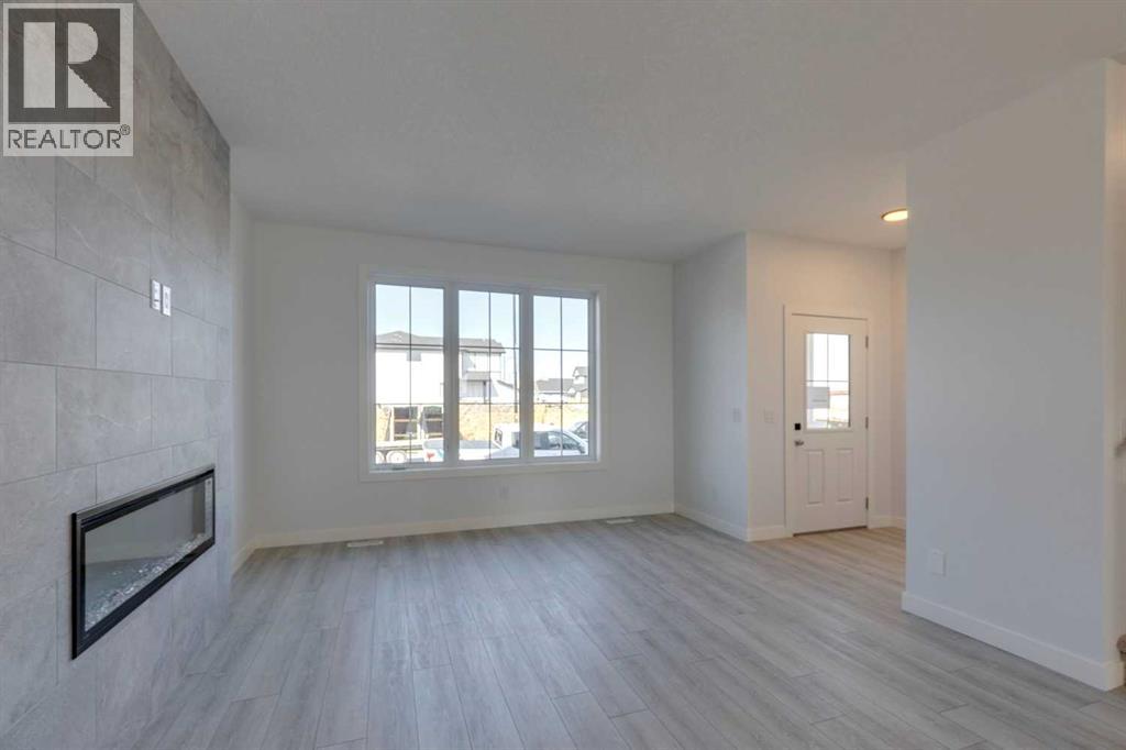 95 Southborough Crescent, Cochrane, Alberta  T4C 3J3 - Photo 3 - A2285095