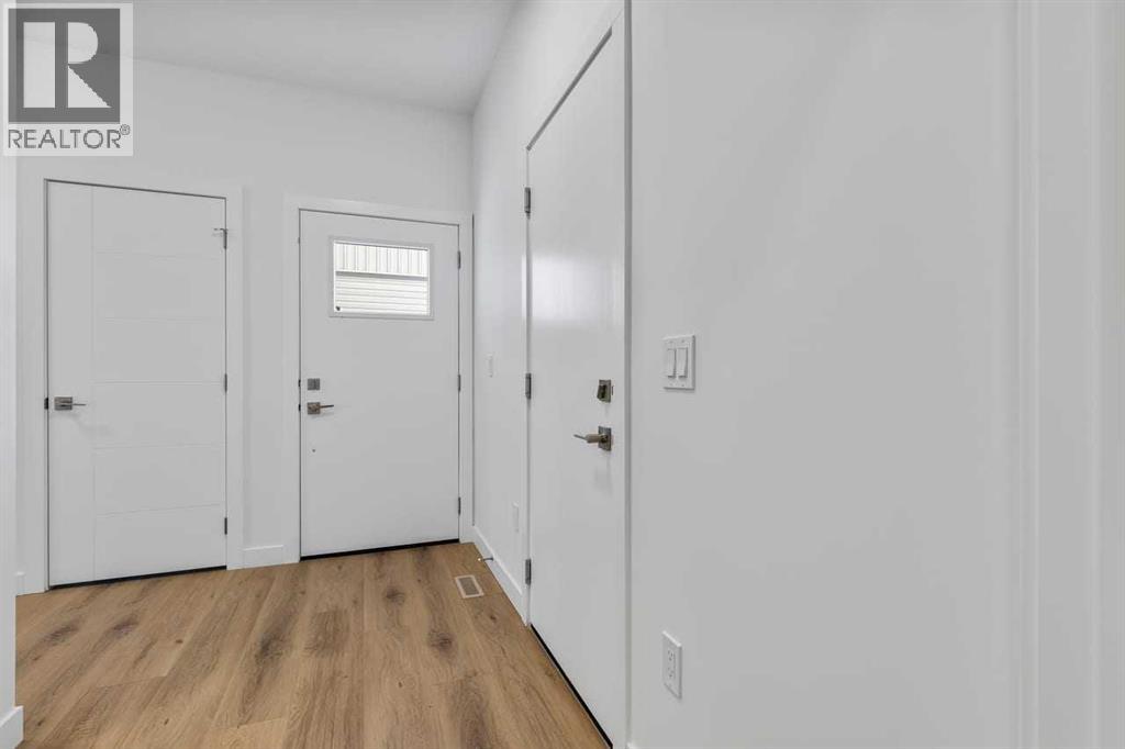 90 Heritage Circle, Cochrane, Alberta  T4C 3G9 - Photo 3 - A2283545