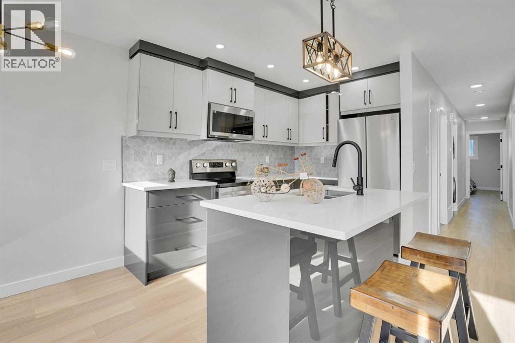 1306 Berkley Drive Nw, Calgary, Alberta  T3K 1S9 - Photo 4 - A2286533