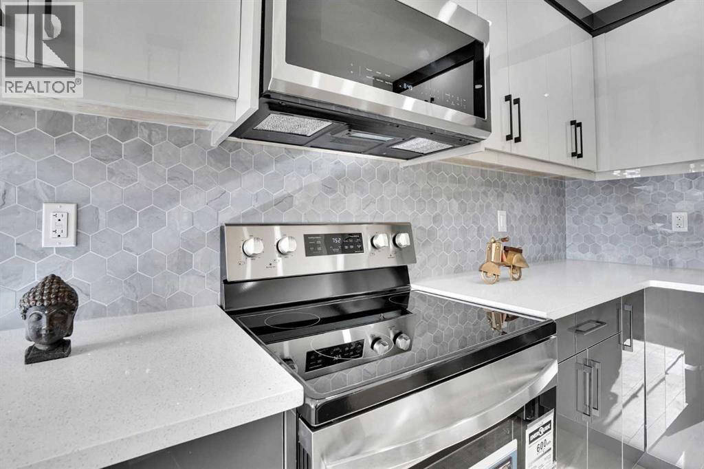 1306 Berkley Drive Nw, Calgary, Alberta  T3K 1S9 - Photo 8 - A2286533