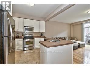 2307 Whistling Springs Cres Crescent E, Oakville, Ontario  L6M 0C5 - Photo 5 - W12791630