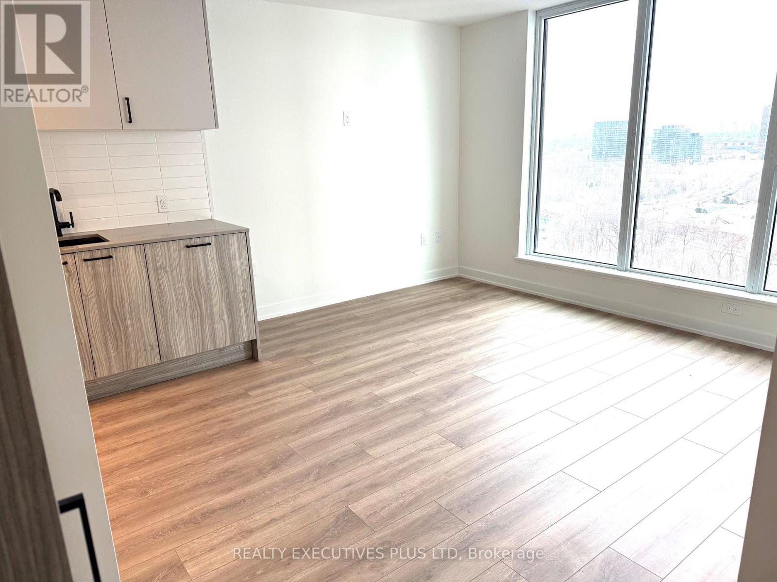 1404 - 1 Quarrington Lane, Toronto, Ontario  M3C 0S4 - Photo 4 - C12792032