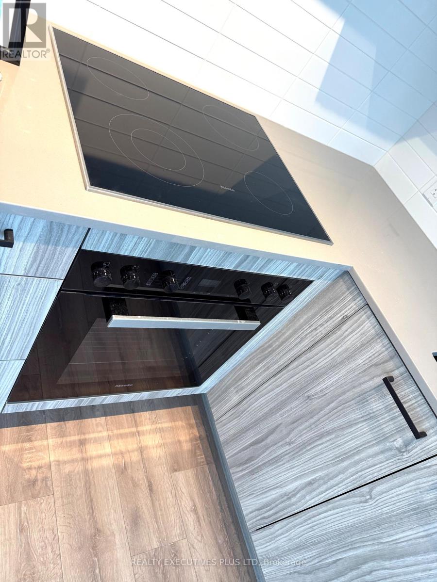 1404 - 1 Quarrington Lane, Toronto, Ontario  M3C 0S4 - Photo 5 - C12792032