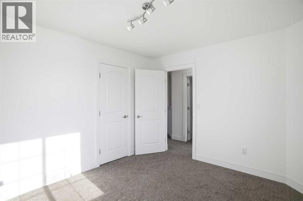 712 Luxstone Landing Sw, Airdrie, Alberta  T4B 3L1 - Photo 36 - A2286053