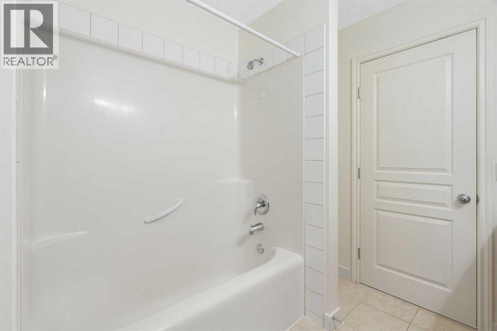 88 Crystal Shores Cove, Okotoks, Alberta  T1S 2B4 - Photo 18 - A2285787