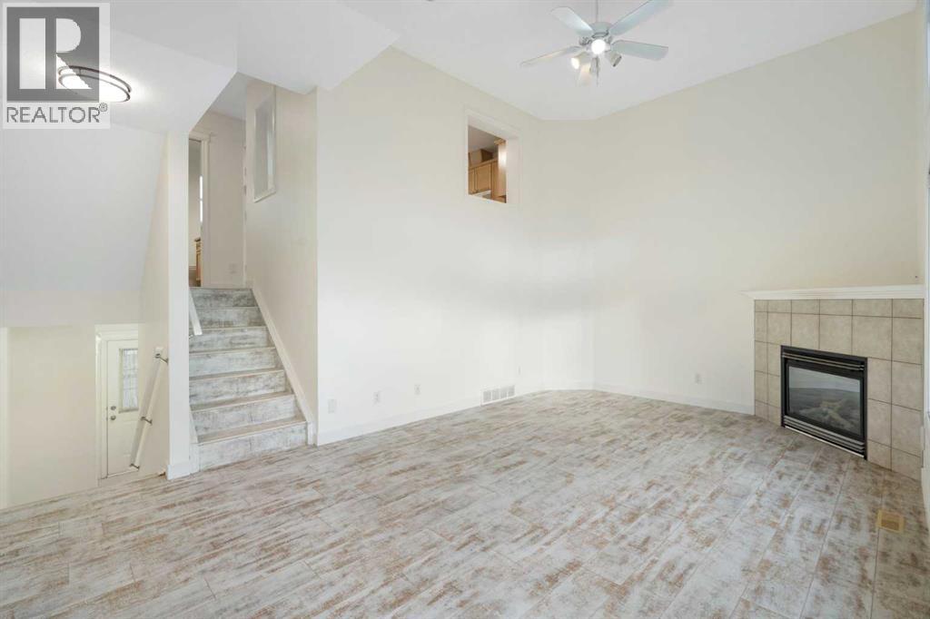 88 Crystal Shores Cove, Okotoks, Alberta  T1S 2B4 - Photo 6 - A2285787