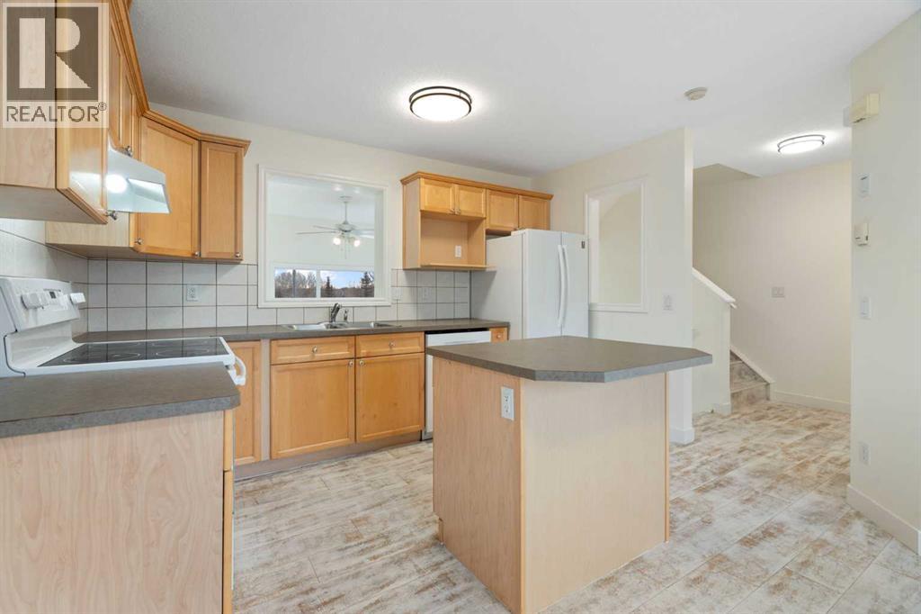 88 Crystal Shores Cove, Okotoks, Alberta  T1S 2B4 - Photo 7 - A2285787