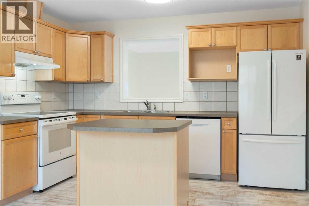 88 Crystal Shores Cove, Okotoks, Alberta  T1S 2B4 - Photo 10 - A2285787