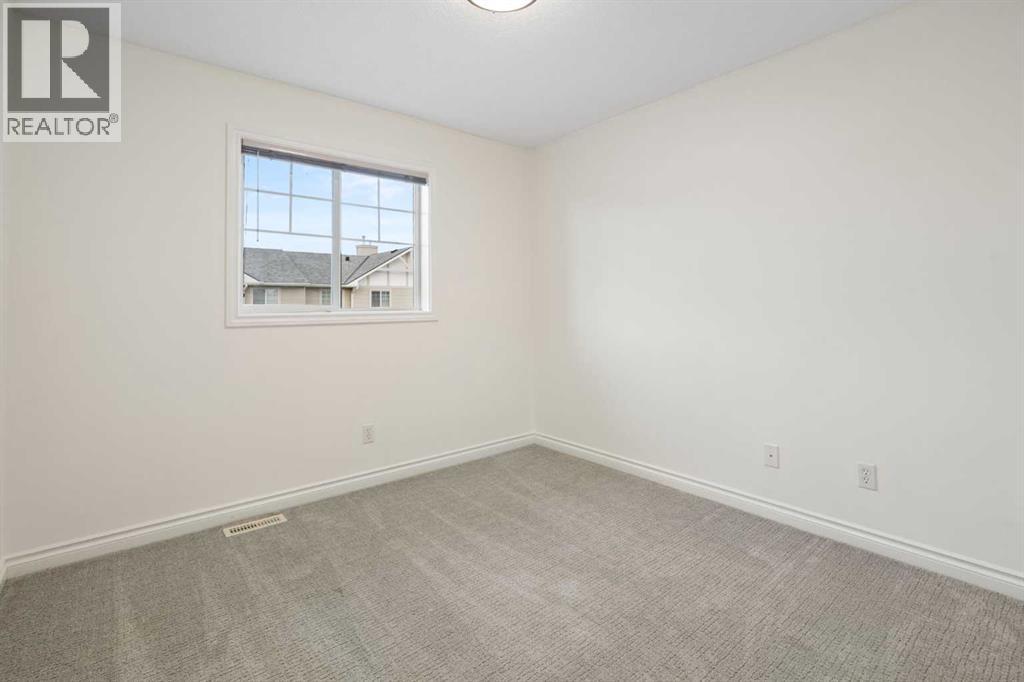 88 Crystal Shores Cove, Okotoks, Alberta  T1S 2B4 - Photo 16 - A2285787