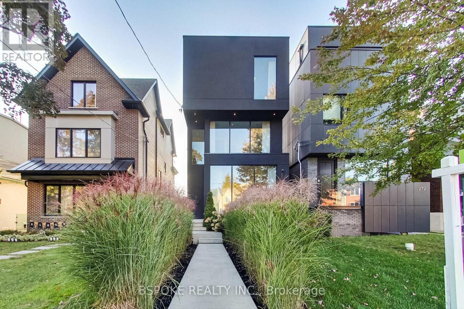 The High Park house that refuses to blend in -- set within easy reach of High Park, 270 Indian Grove stands apart. Built in 2016 this detached three-storey custom-built home offers 2,450 sq ft above grade plus 904 below, with space that's both generous and intelligently planned. The main floor is open yet defined, anchored by a three-sided Scandinavian gas fireplace that adds warmth without sacrificing flow. The kitchen is designed for serious cooking and seamless entertaining, featuring integrated top-tier (Thermador) appliances, two fridges (one just for drinks), a double oven, appliance garage, and an oversized island. A full sliding wall opens to a covered rear patio with gas BBQ line, extending living space outdoors. The private, low-maintenance backyard connects directly to a modern two-car detached garage via laneway (with laneway home potential). The second floor includes two bedrooms, a full bath, laundry, and a large family room-ideal for kids, work, or a separate lounge space. The third level is dedicated entirely to the primary suite, complete with walkout terrace, substantial walk-in closet, and a sleek ensuite with floating tub and frameless glass shower. Floor-to-ceiling windows and high ceilings flood the home with light, while built-in speakers and heated bathroom floors reflect thoughtful construction rarely found in resale-driven builds. The finished lower level offers a separate entrance, spacious den with a window and door, and full bath, creating flexibility for guests, extended family, or workspace (plus, the floors are heated for ambient warmth). Steps to High Park, walking distance to Roncesvalles and Bloor West Village, five minutes to Keele subway, and quick access to the Gardiner, this is modern urban living without compromise. (id:48254)