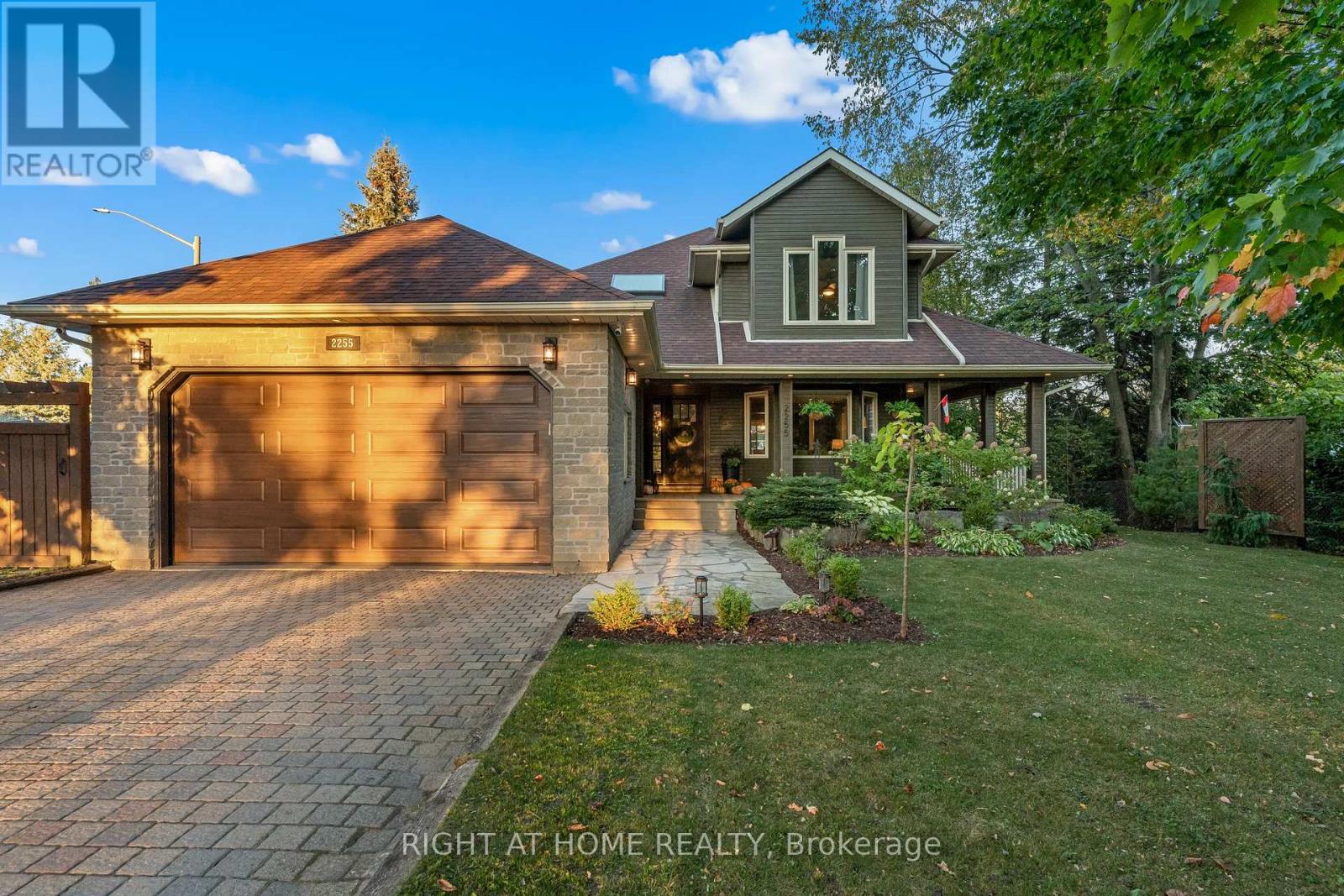 Set on a  67 x 201 ft treed corner lot in one of Alcona's most sought after neighbourhoods, this 3+1 bedroom, 3 bathroom home offers space, privacy, and the kind of layout that truly works for real life.The wrap around porch is more than curb appeal. It is where morning coffee tastes better and summer evenings stretch a little longer.Inside, the heart of the home is the kitchen. Quartz countertops, a generous centre island, and open sightlines to the living and dining areas make it easy to host, connect, and keep everyone close. Hardwood and engineered hardwood flooring bring warmth and character, while main floor laundry and inside entry from the heated garage make everyday routines seamless.Upstairs, the primary suite feels like your own quiet corner of the house. A spacious walk in closet and a spa inspired 5 piece ensuite create a space to slow down and reset. Hardwood flooring sits beneath the carpet, giving you options for the future.The partially finished basement adds flexibility with a large additional bedroom, recreation space, and plenty of storage. Perfect for guests, teens, a home office, or simply extra room to spread out.Outside, mature trees frame the yard and provide privacy you simply cannot recreate in newer builds. Perennial gardens return year after year with minimal upkeep. A gas BBQ hookup, no sidewalk cutting into the driveway, and the added space of a corner lot are details that matter.Located minutes from Innisfil Beach Park, Lake Simcoe, the boat launch, dog beach, parks, and quick access to Hwy 400, this is a home that balances comfort, location, and long term value.Basement interior area: 1,366.36 sq ft including unfinished space. (id:48254)