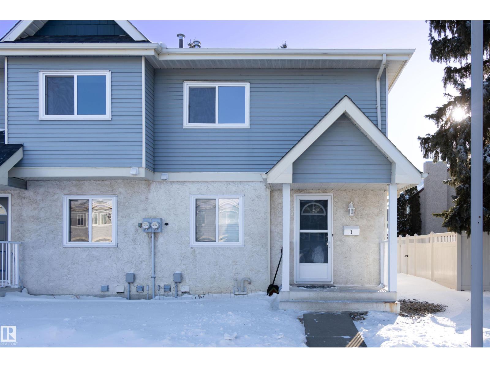 Welcome to Mayfield Mews! This beautifully renovated townhome in the desirable community of La Perle offers low condo fees and a pet-friendly, well-managed complex—perfect for first-time buyers or investors. The open-concept main floor showcases quality flooring, designer lighting, and a stunning kitchen with granite countertops, stainless steel appliances, modern chimney hood fan, full-height soft-close cabinetry, custom subway tile backsplash, and a raised breakfast bar overlooking the bright living room. Patio doors lead to a fully fenced, southwest-facing private yard. A dining area and 2-piece bath complete the main level. Upstairs features three spacious bedrooms with built-in closet organizers and an updated family bath with high-end finishes. The fully finished basement adds a large family room and ample storage. Two parking stalls right out front and quick access to 178 Street, Anthony Henday, and Whitemud make this home an absolute must-see! (id:48254)