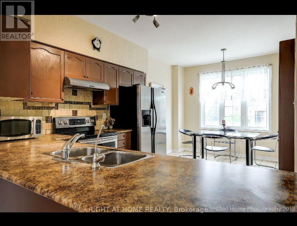 44 - 7155 Magistrate Terrace, Mississauga (Meadowvale Village), Ontario  L5W 1Y8 - Photo 2 - W12808916