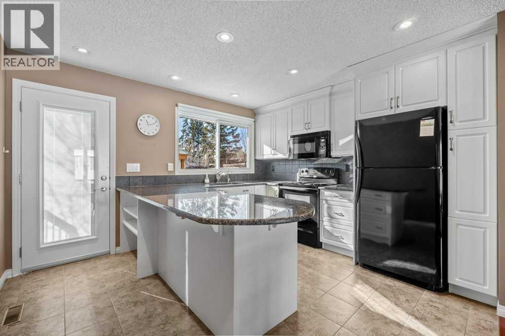 417 Huntington Way Ne, Calgary, Alberta  T2K 5A7 - Photo 7 - A2287372