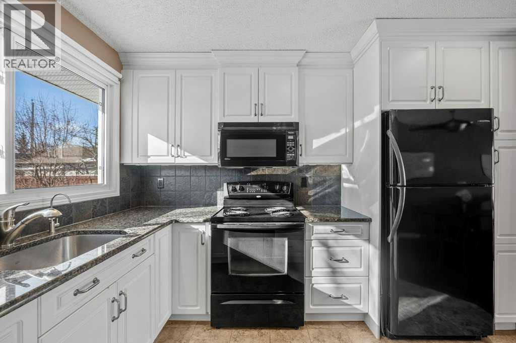 417 Huntington Way Ne, Calgary, Alberta  T2K 5A7 - Photo 9 - A2287372