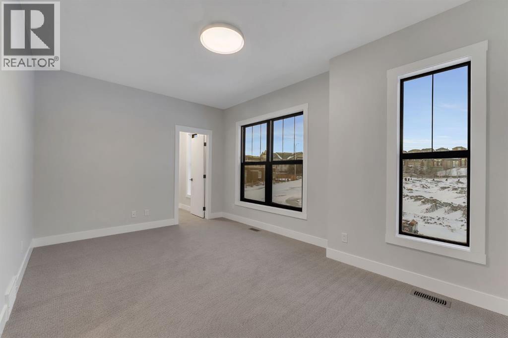 12 Spring Creek Point Sw, Calgary, Alberta  T3H 6E2 - Photo 31 - A2275769