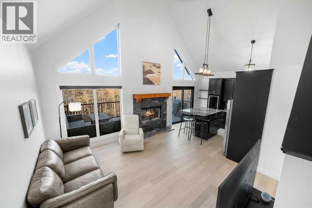 247 Cottageclub Crescent, Rural Rocky View County, Alberta  T4C 1B1 - Photo 16 - A2271474