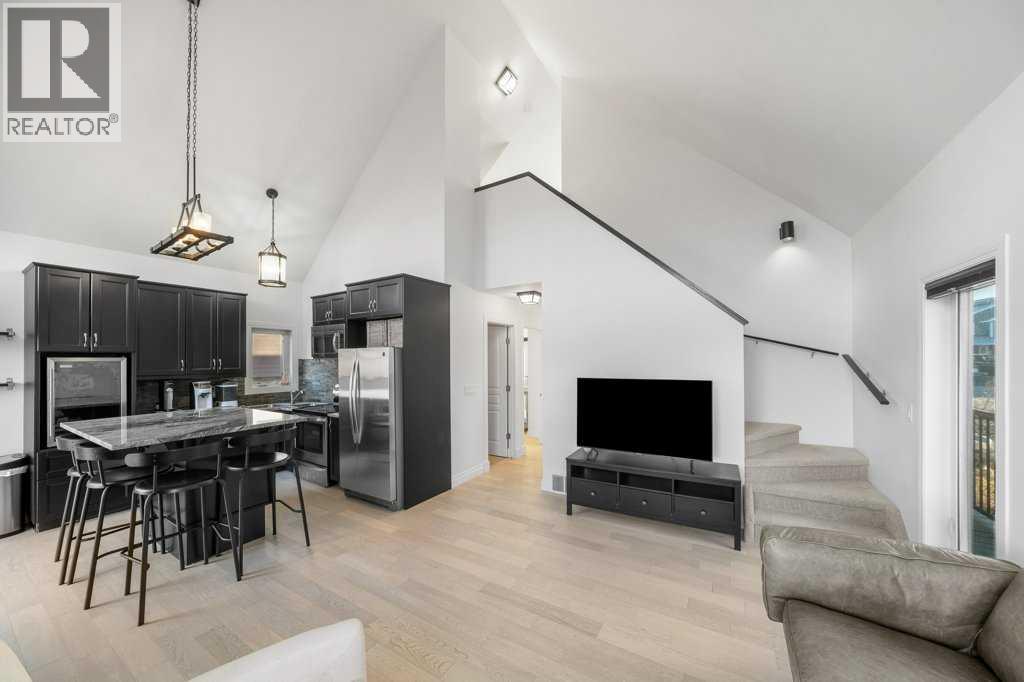 247 Cottageclub Crescent, Rural Rocky View County, Alberta  T4C 1B1 - Photo 11 - A2271474