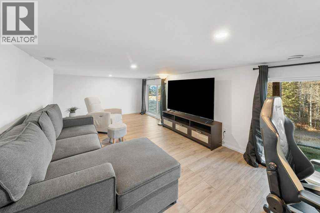 247 Cottageclub Crescent, Rural Rocky View County, Alberta  T4C 1B1 - Photo 32 - A2271474