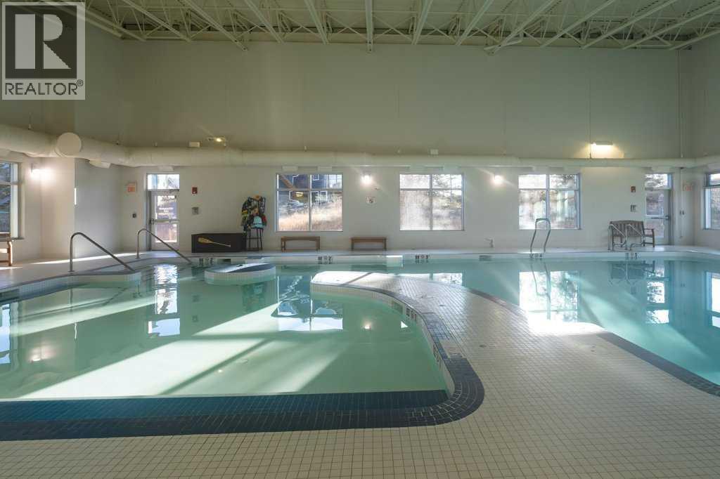 247 Cottageclub Crescent, Rural Rocky View County, Alberta  T4C 1B1 - Photo 39 - A2271474