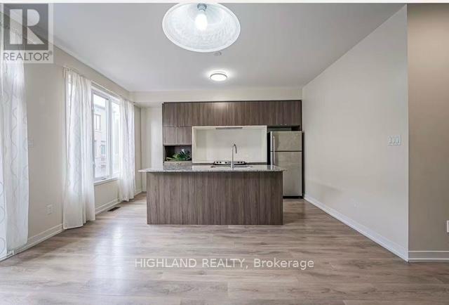 Suite A - 167 Squire Crescent, Oakville, Ontario  L6H 0L7 - Photo 5 - W12810454