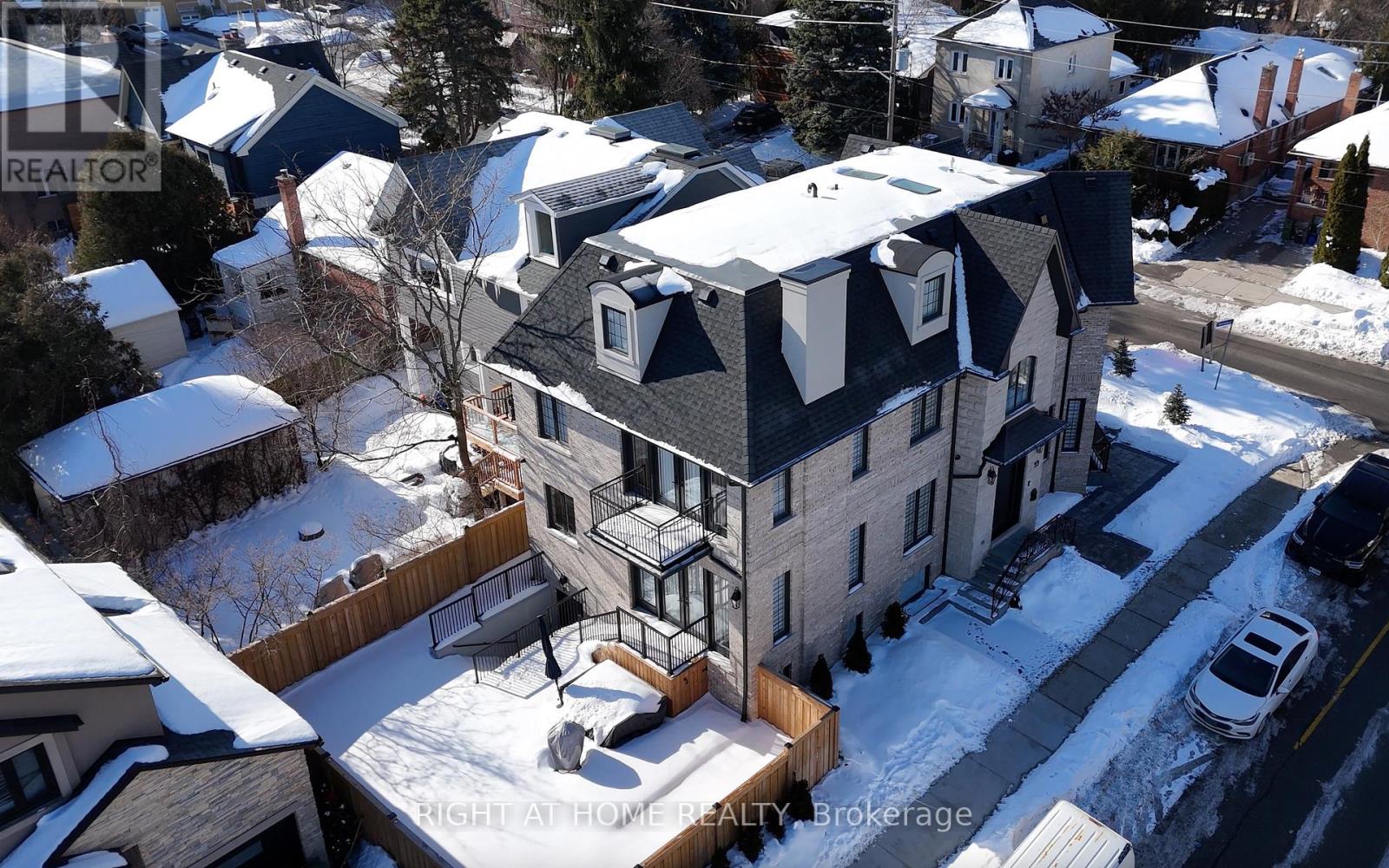 A newly built custom residence in the Kingsway, one of Etobicoke's finest and highly sought-after neighbourhoods known for its vibrant family-oriented community, top schools and walkable neighbourhood charm.This grand three-story home boasts over 5,000 square feet, perfectly designed for a growing family-offering generous gathering areas, comfortable private spaces, and room to create lasting memories together. The ground floor showcases an elegant layout, highlighted by stunning fireplace and exquisite custom millwork. The chef-inspired kitchen features a spacious eat-in island, premium built-in appliances, and abundant prep and storage areas. Seamlessly connected living and dinning areas create an airy, flowing environment idea for everyday living. Upstairs, the primary suite offers a tranquil retreat with a private balcony, custom walk-in closet & make-up table, spa-inspired ensuite & custom window covers.Three additional bedrooms, each with designer finishes and two bathrooms completed this level.The top floor adds a large -scale suit ideal for Guests/Game Room/Teen Haven/Art Studio or more. The lower level impresses with a spectacular recreation room, gym, wet bar, wine rack, nanny suite, bathroom, laundry room & radiant heating.                                 Ideally located just steps from top-rated Lambton Kingsway School, swimming pool, parks, panoramic Humber River trail, picturesque Old Mill Inn, as well as a wide array of shops, cafes, dinning & transit including the subway. (id:48254)