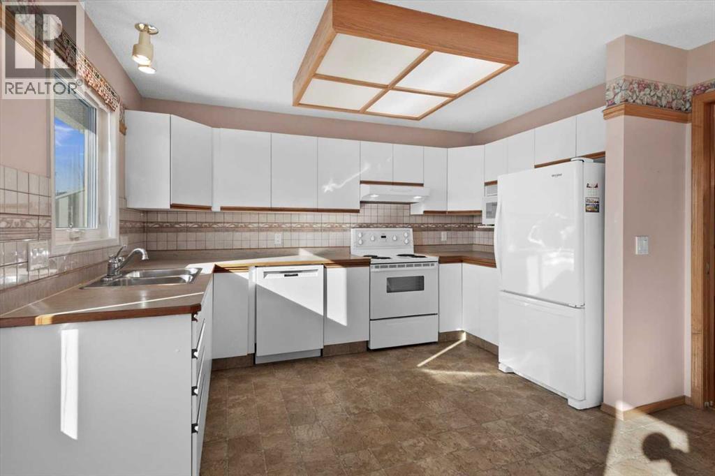 222 Arbour Cliff Close Nw, Calgary, Alberta  T3G 3W7 - Photo 7 - A2286436