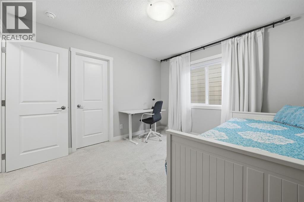 902 Bluerock Way Sw, Calgary, Alberta  T2Y 0S5 - Photo 25 - A2286798