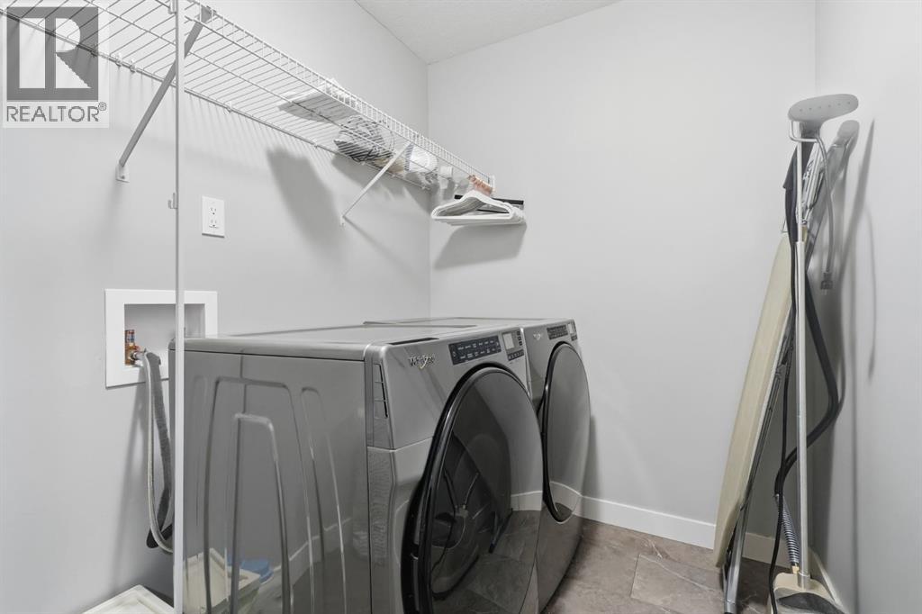 902 Bluerock Way Sw, Calgary, Alberta  T2Y 0S5 - Photo 27 - A2286798